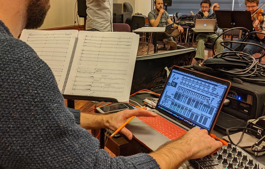 A graduate composer works with electronics and instrumentalists