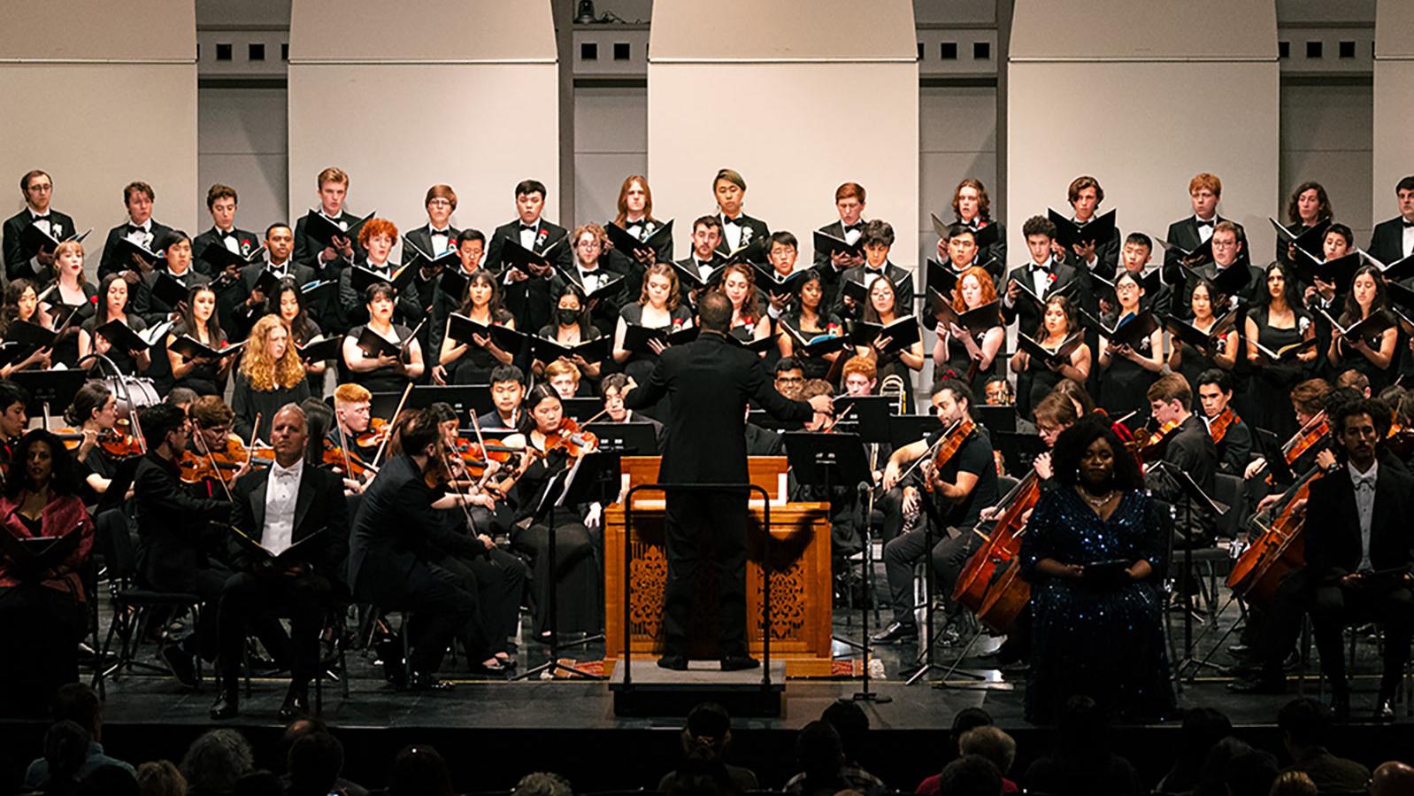 Chorus and orchestra performing onstage